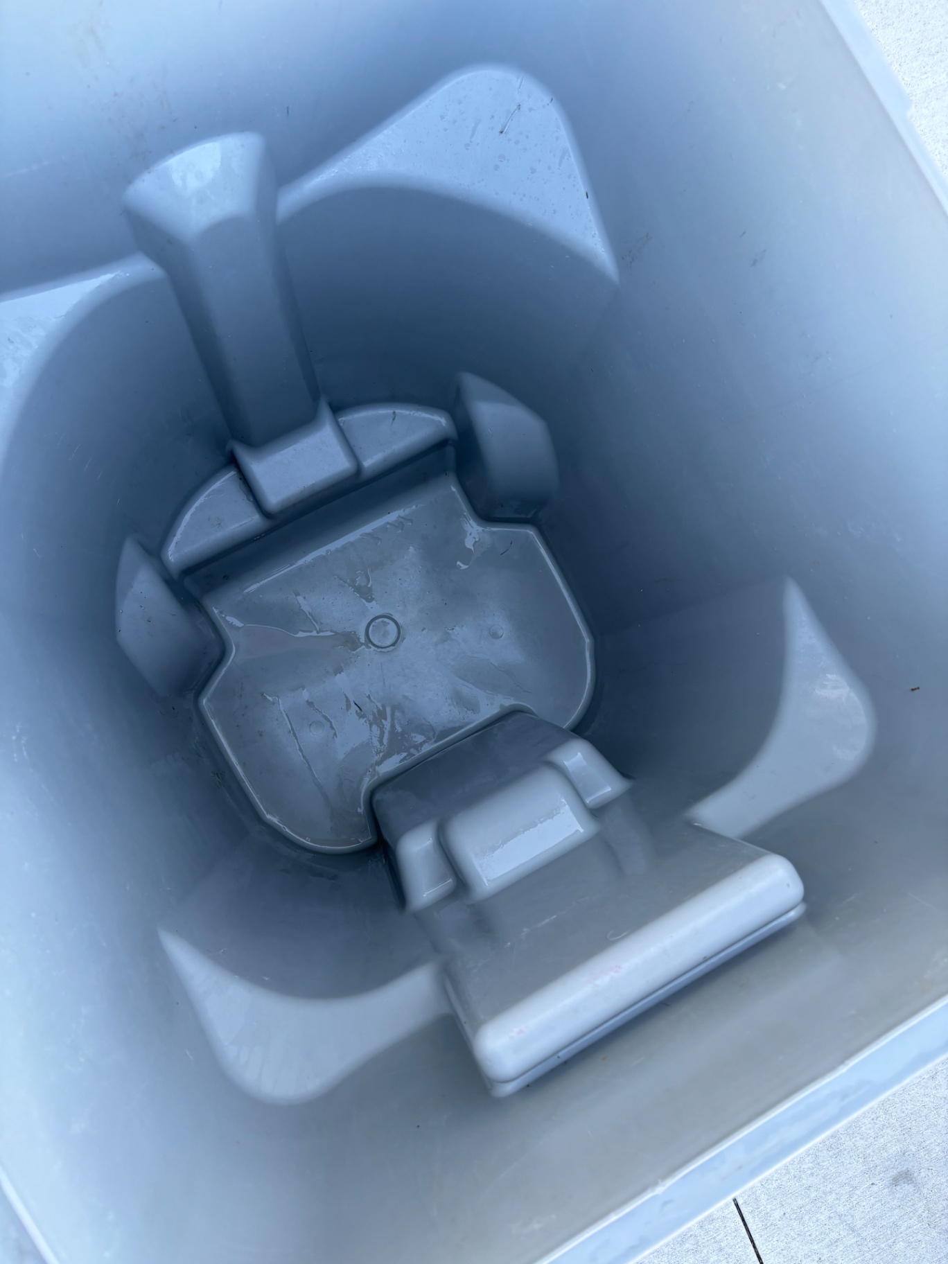 Freshly cleaned and hand-dried residential trash can
