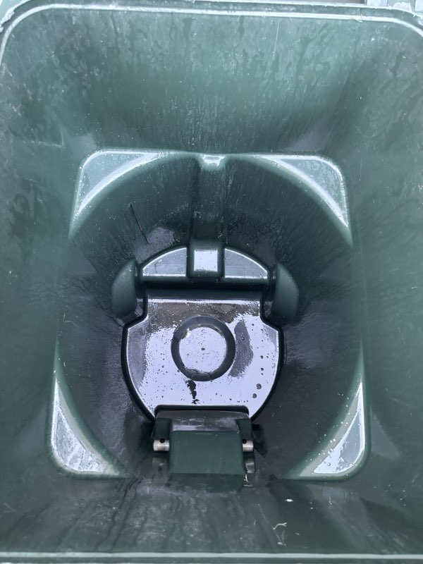 Customer trash bin after Clean The Cans hot-water cleaning — interior is shiny and sanitized